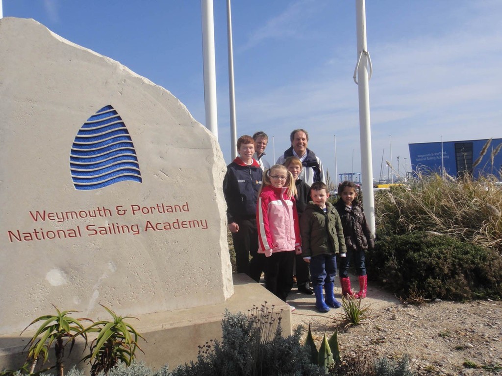 John Tweed, Chief Executive at the Weymouth and Portland National Sailing Academy, with young sailors and Olympic medallist © WPNSA